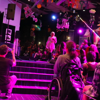 A performer on the stage during Drag in the Theatre.