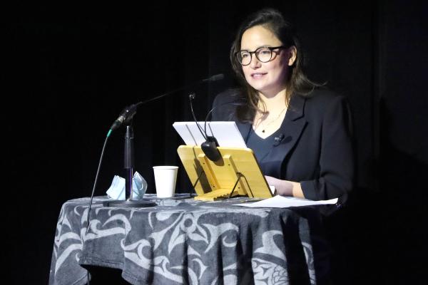 Indigenous Speakers Series keynote Connie Walker speaks at a podium in the Malaspina Theatre