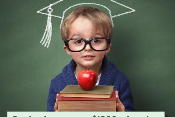 Image of kid holding books and an apple