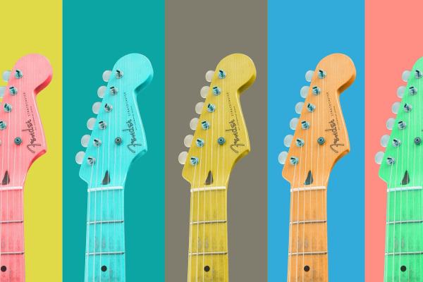 The top half of guitars pictured against yellow, green, grey, blue and peach backgrounds.