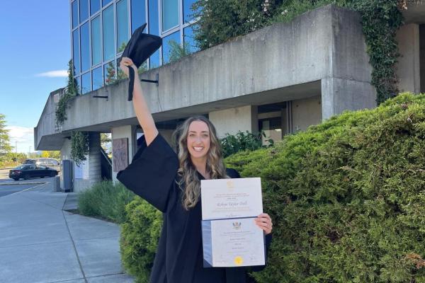 VIU graduate Robyn Doll smiling with diploma