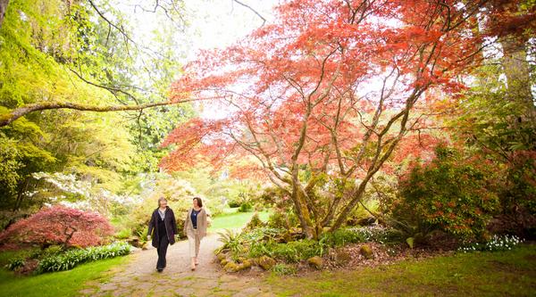 Two women walking a trail at Milner Gardens