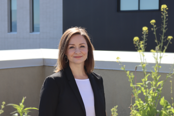 Dr. Patricia Johnston standing outside at VIU looking at camera