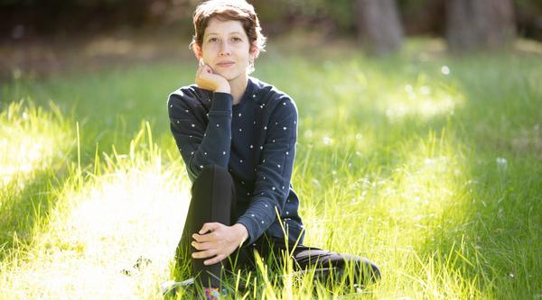 Student sitting in grass