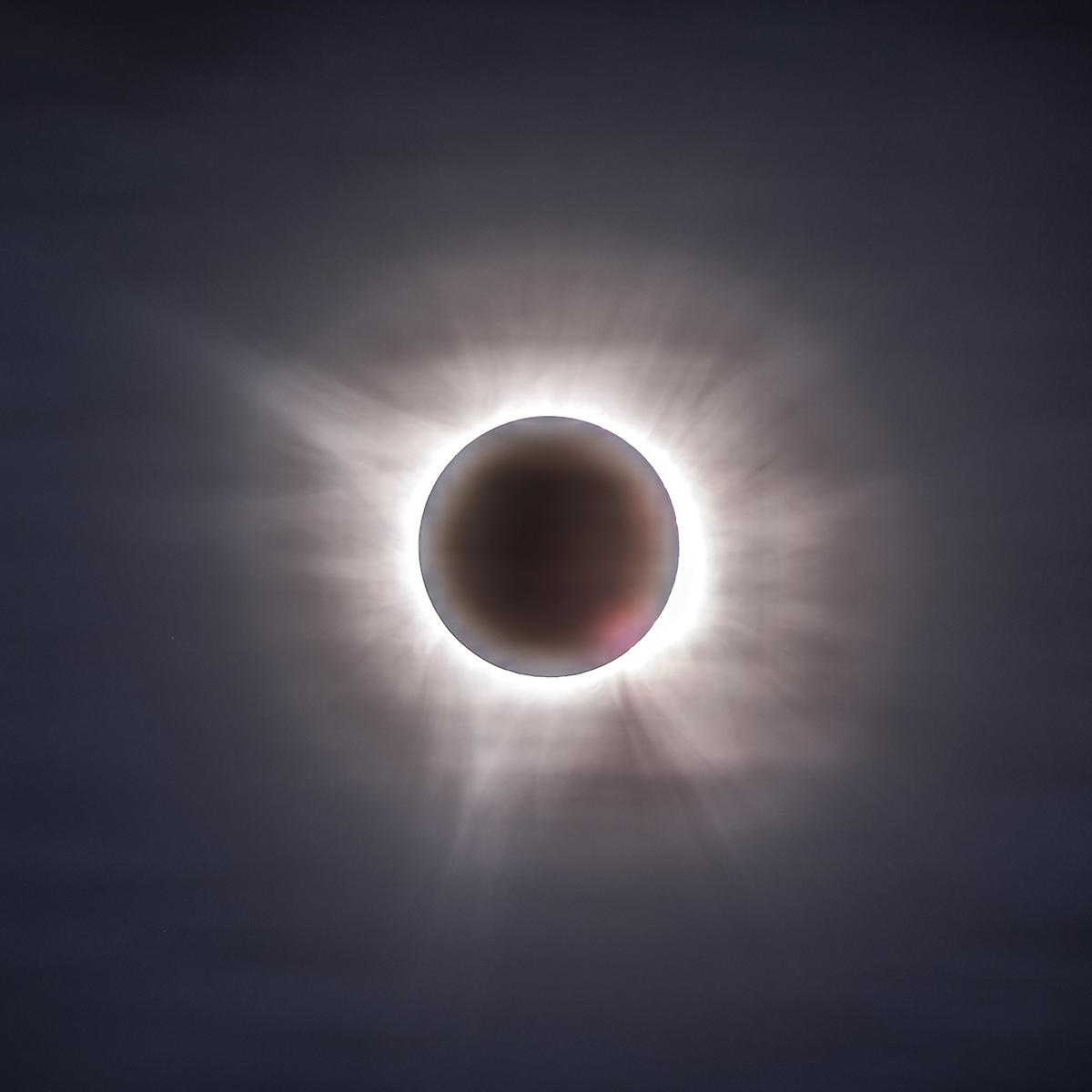 The fainter outer portions of the solar corona. Just like in children’s drawings of the Sun, the corona has a spiky, asymmetric shape to it and appears very different for every total solar eclipse. 