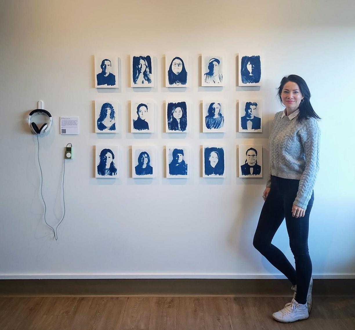 Tarah Dowling stands next to her exhibit.